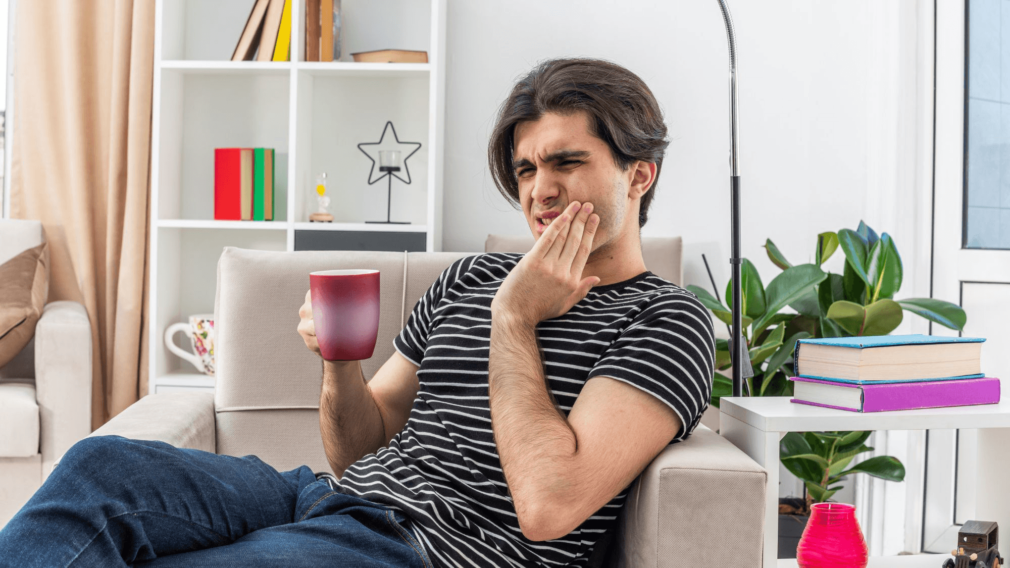 A boy drinking coffee at home, highlighting early warning signs for dental care and oral health by a Glendale dentist
