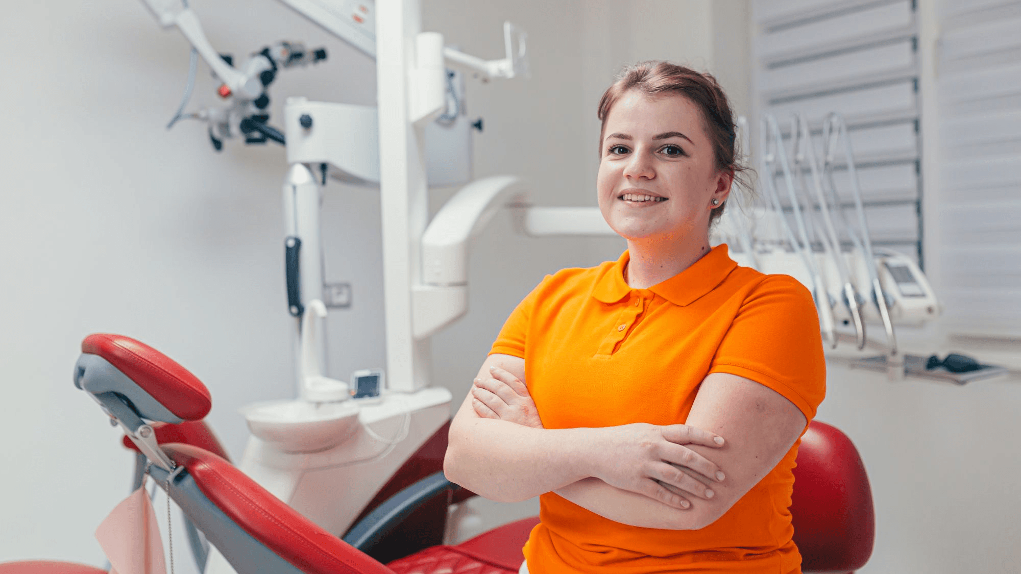 Female Glendale dentist standing while explaining how often you should visit a dentist in Glendale